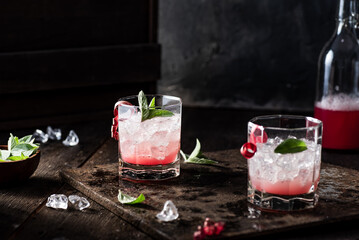 Rhubarb lemonade with fresh mint. Dark background.