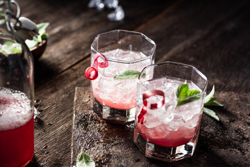 Rhubarb lemonade with fresh mint. Dark background.