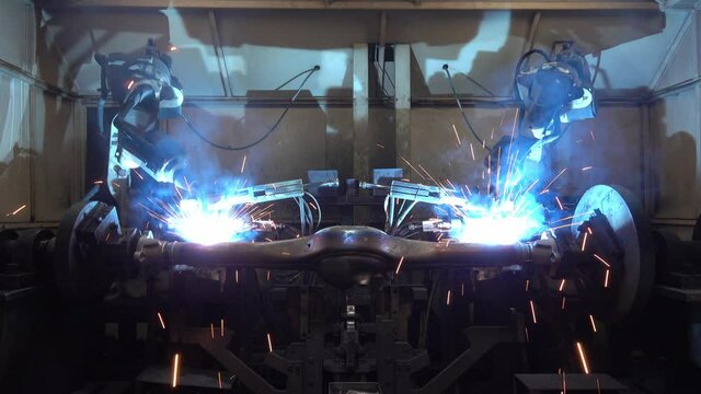 Automation welding mechanical procedure.,Industrial Robot arm active in factory