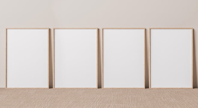 Blank vertical poster frame mock up standing on beige floor. Four wooden frames isolated in Scandinavian interior. 3d render