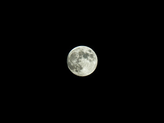 Detailed close-up of full moon against black sky. Sharp view on Tycho and Copernicus Craters. Good visibility of Sea of Serenity and Sea of Tranquillity.