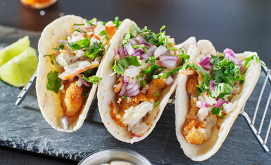 mexican fish tacos in metal tray