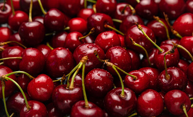 Fresh ripe black cherries background Top view 