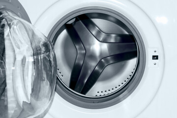 Washing machine without laundry, with a round drum for washing.