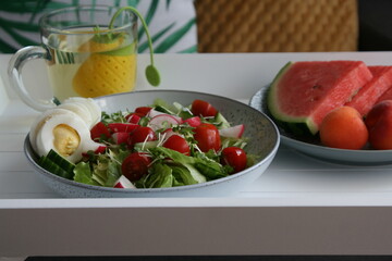 salad with fresh vegetables and an egg