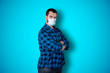 Unshaven confident serious young male entrepreneur with attractive appearance dressed casually isolated over chroma studio background. Stylish handsome guy indoor. Coronavirus concept