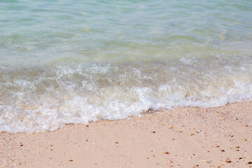 Sandy beach and blue sea in summer