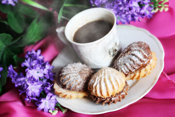 Hot coffee and delicious cookies and flowers, Breakfast