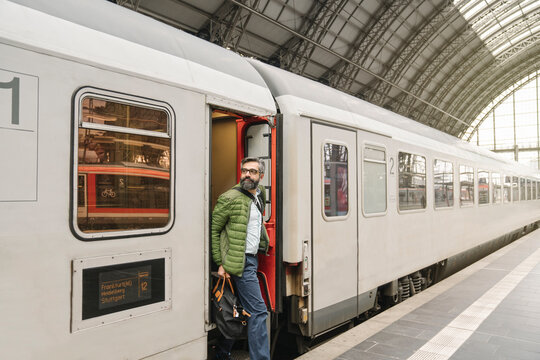 Man getting off a train