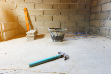 Tools used construction in brick block cement wall.