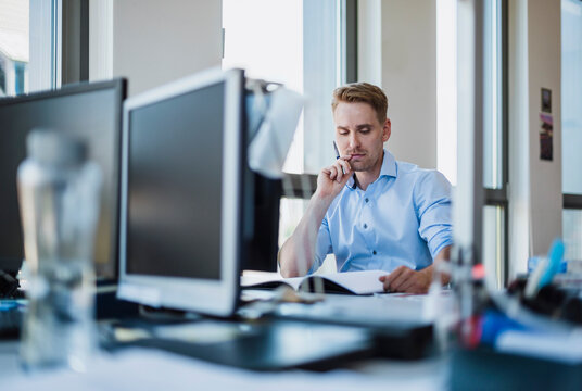 Businessman working at desk in office