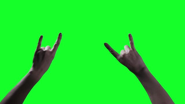 Woman Hand showing Devil Horns against Green Background. Close Up. You can replace green screen with the footage or picture you want. You can do it with &ldquo;Keying&rdquo; effect in After Effects.
