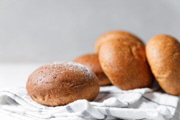 Fresh baked buns on bright background.