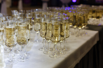 A row of wine glasses sitting on a table