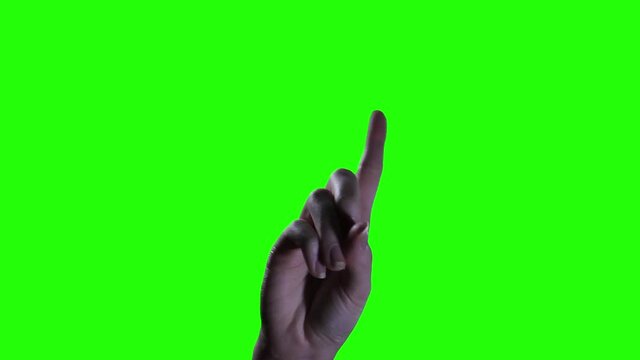 Woman Hand is saying NO with its Finger over Green Background. Close-Up. 