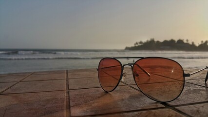 Fototapeta na wymiar sun glasses on the beach