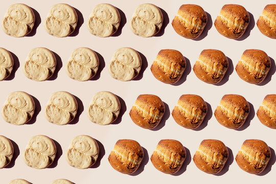 Pattern of rows of raw dough lumps and baked breads