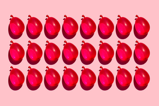 Studio shot of rows of red water balloons
