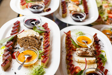 A table topped with plates of food on a plate