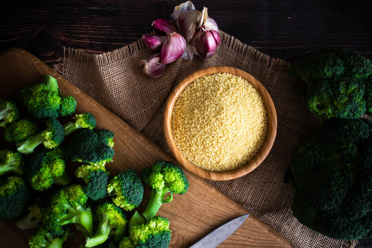 Bowl of couscous, garlic and fresh broccoli