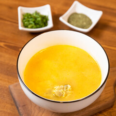 Yellow ginger soup with vinegar