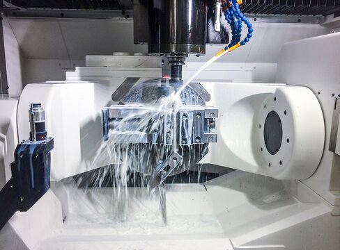 New high performance 5 axis CNC machining centre. Milling process with emulsion.