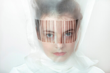 Portrait of young woman wearing  transparent mask with bar code