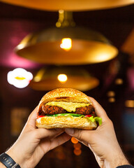 Man holding Vegetarian, Veggie burger