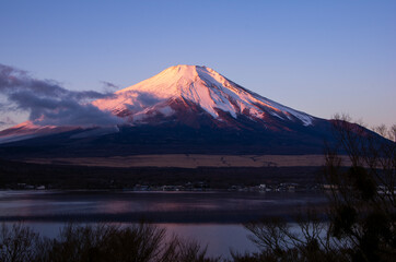 Fototapeta na wymiar Red Mt Fuji during sunrise from Lake Yamanaka, Japan