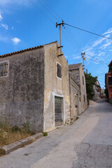 Fototapeta na wymiar Old, lonely houses on small isolated island Vrgada in Adriatic sea, Croatia