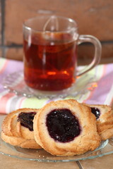 Marzipan cookies with jam and cup of tea