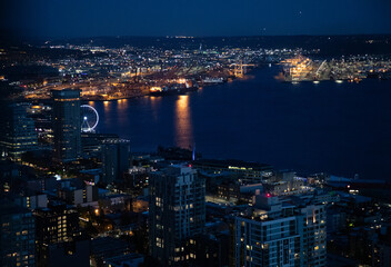 Fototapeta na wymiar City Lights and Downtown Seattle skyline cityscape as seen at night from the Space Needle. 