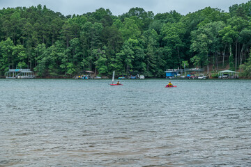 Fototapeta na wymiar Kayakers fishing on the lake