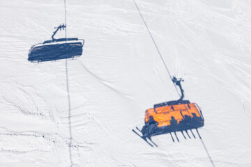 Germany, Bavaria, Garmisch-Partenkirchen, Shadows of skiers riding chairlift atÔøΩZugspitze