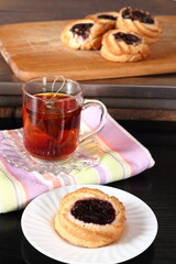 Marzipan cookies with jam and cup of tea