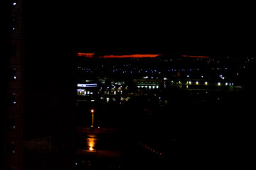 after sunset red sky in the city view from the balcony