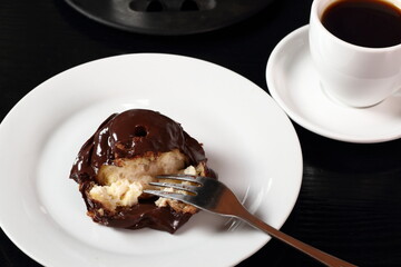 Choux with chocolate ganache and coffee cup