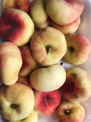 Delicious juicy peaches on the table macro