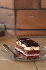 Layer cake with fruit and cream fillings decorated chocolate icing
