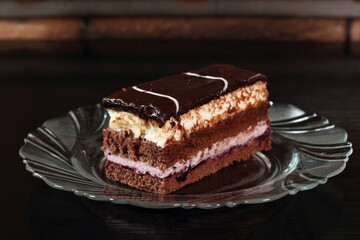Layer cake with fruit and cream fillings decorated chocolate icing