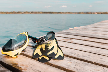 view of snorkeling diving mask at wooden pier