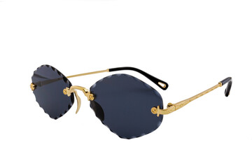 Rimless sunglasses with dark blue rhomboid shaped lenses and gold thin frames isolated on white...