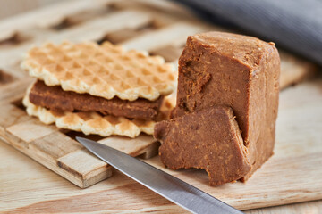 Viennese waffles with Norwegian brunost cheese. Breakfast with Traditional Scandinavian brown cheese
