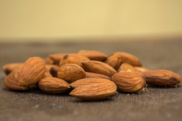 Organic almonds on wooden surface