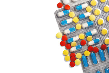 pile of medical pills in red, blue colors in silver plastic packaging