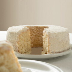 white cake cut on the table