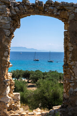 Nice view trough a door towards Filiatro beach and yachts, Ithaka island, Greece
