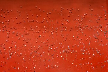 water drops and bubbles on a red background