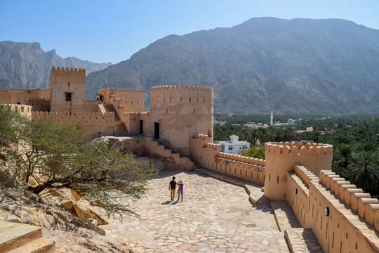 People visiting Nakhal Fort, in Oman.