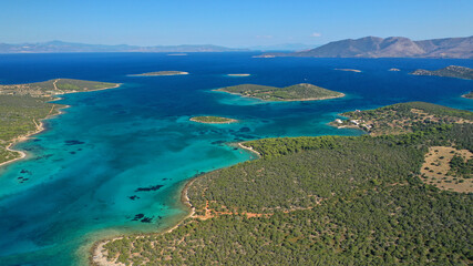 Fototapeta na wymiar Aerial drone photo of beautiful paradise island complex in gulf of Petalion that form a blue lagoon in South Evia island near Marmari, Greece